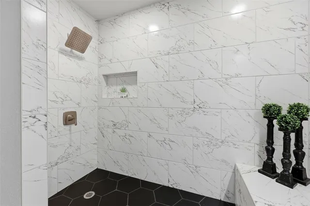 a bathroom with a granite countertop sink a large mirror and vanity