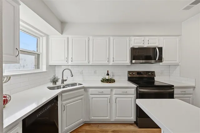 a view of a brick house with a large door