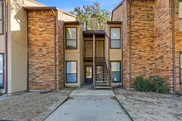 a view of a balcony with wooden floor and door