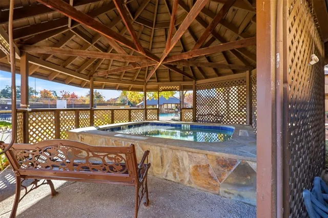 a view of a swimming pool with a yard