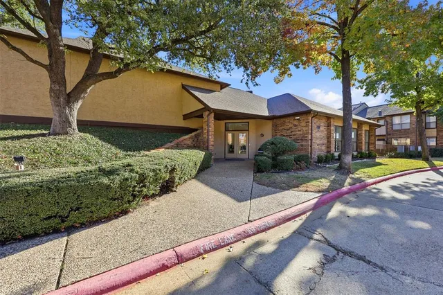 a bathroom with a glass shower door and mirror