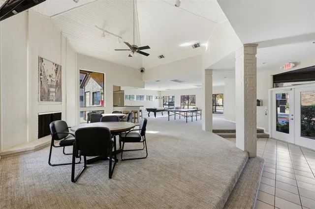 a living room with furniture a table and chairs
