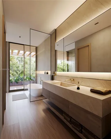 a large white kitchen with a large window