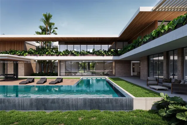 swimming pool view with a seating space and a garden view
