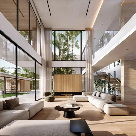 a living room with couches and a large window with garden view