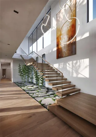 a view of entryway and hall with wooden floor
