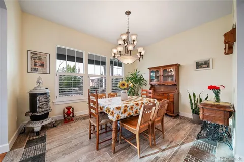 a view of a living room kitchen and a wooden floor
