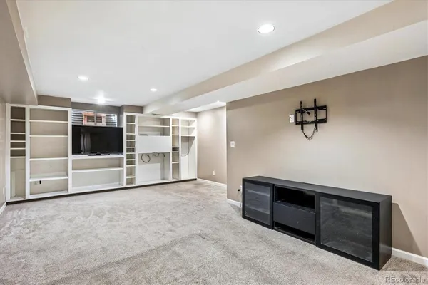 a view of an empty room with a fireplace