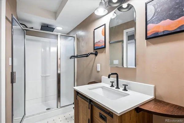 a bathroom with a sink and a mirror
