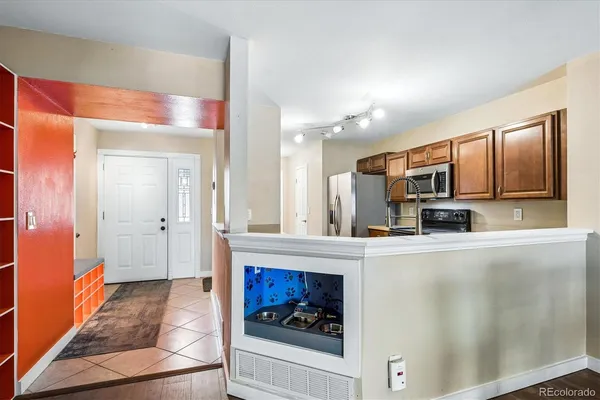 a open kitchen with granite countertop a stove and a sink