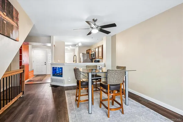 a view of a dining room with furniture and wooden floor