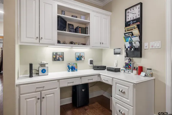 a kitchen with a sink cabinets and window