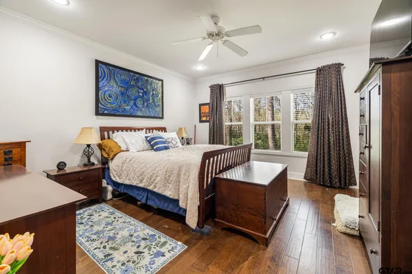 a bedroom with a large bed and a couch