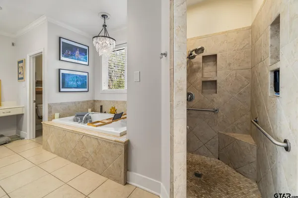 a bathroom with a sink a vanity and a shower