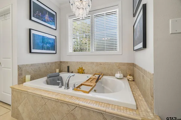 a bathroom with a bathtub and a window