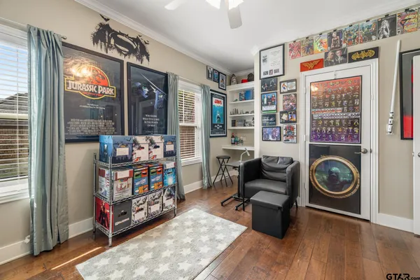 a living room with furniture a rug and a window