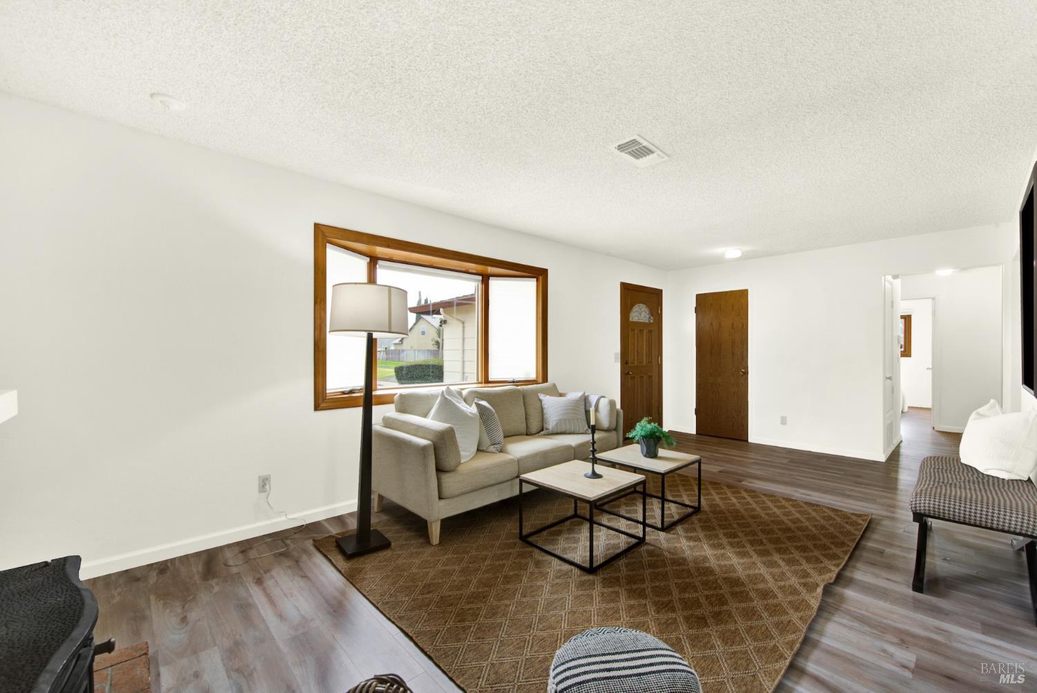 2219 Channing Court Fairfield, CA 94533 - Photo 15 of 81 a living room with furniture and a couch