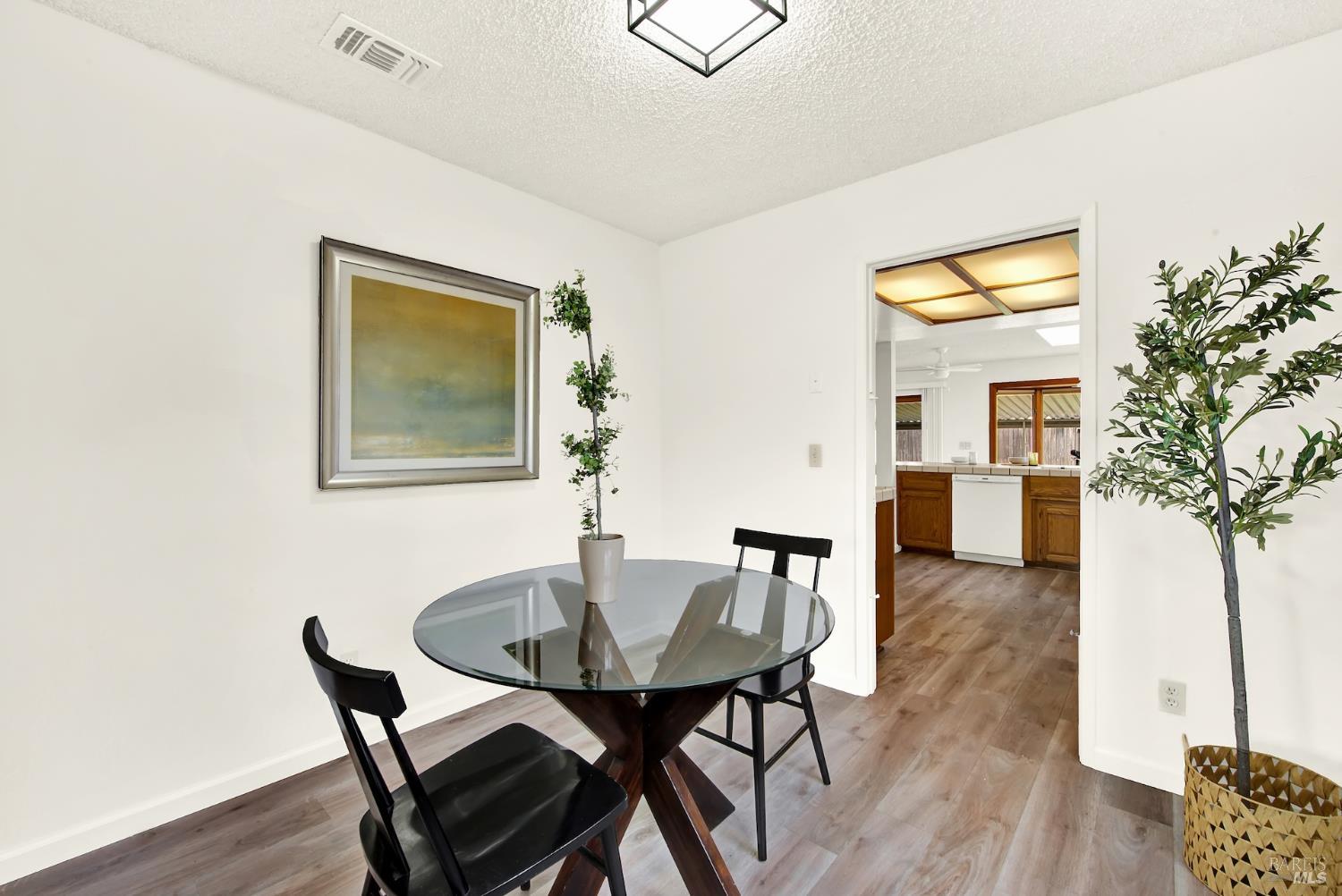 2219 Channing Court Fairfield, CA 94533 - Photo 20 of 81 a view of a dining room with furniture and wooden floor