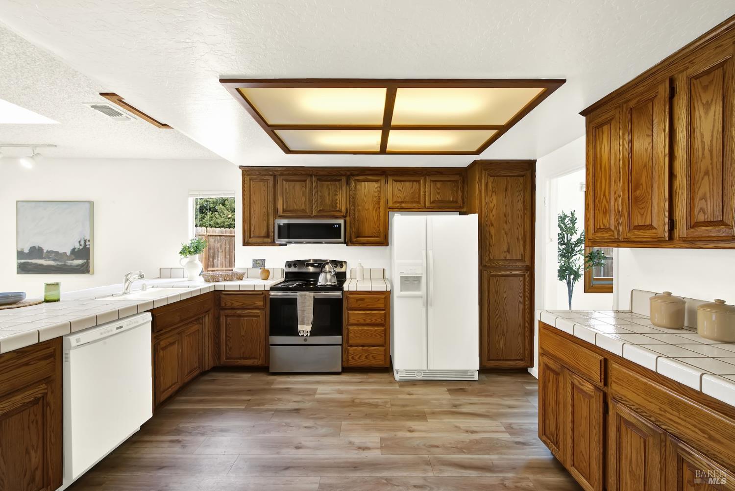2219 Channing Court Fairfield, CA 94533 - Photo 24 of 81 a kitchen with stainless steel appliances granite countertop a refrigerator and a stove top oven