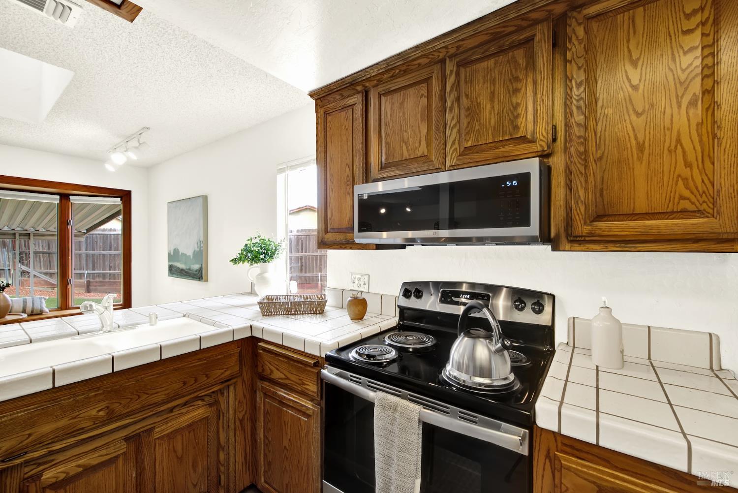 2219 Channing Court Fairfield, CA 94533 - Photo 27 of 81 a kitchen with a stove and a sink