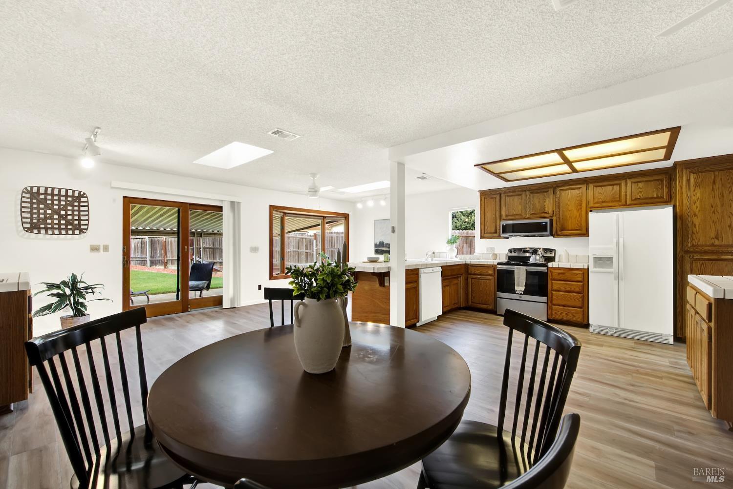 2219 Channing Court Fairfield, CA 94533 - Photo 40 of 81 a view of a dining room with furniture window and wooden floor