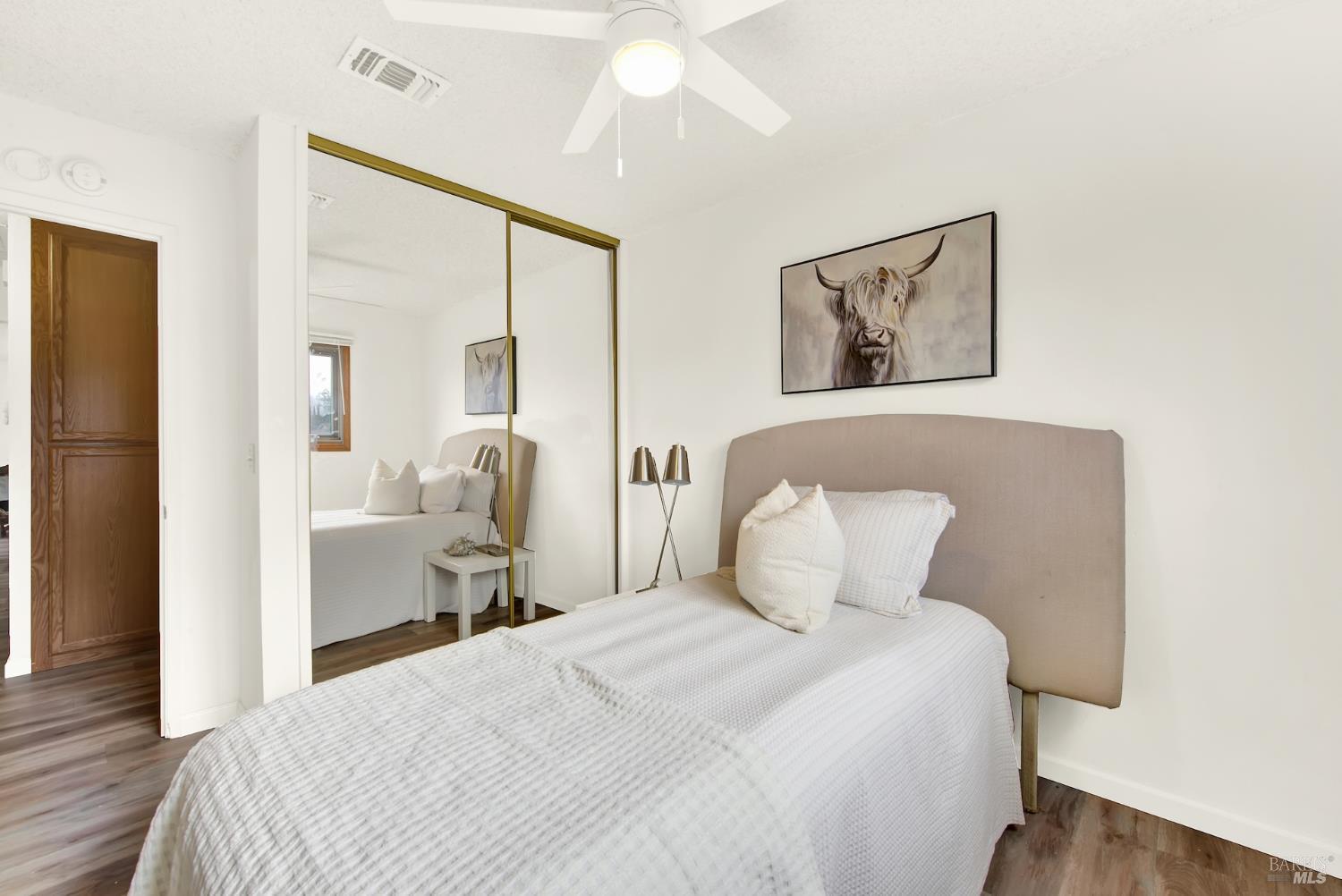 2219 Channing Court Fairfield, CA 94533 - Photo 44 of 81 a bedroom with a bed and wooden floor