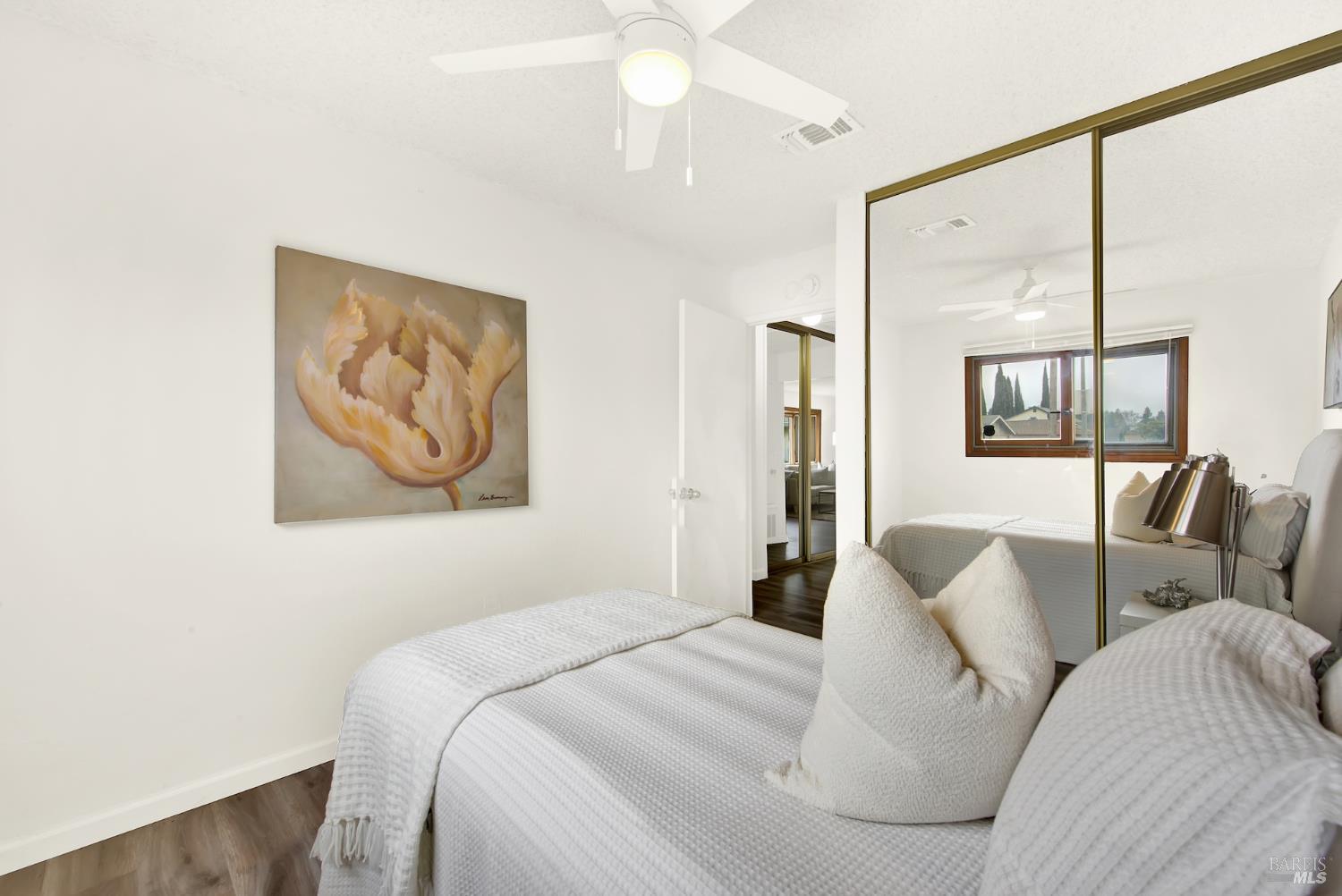 2219 Channing Court Fairfield, CA 94533 - Photo 45 of 81 a bedroom with a large bed and a painting on the wall