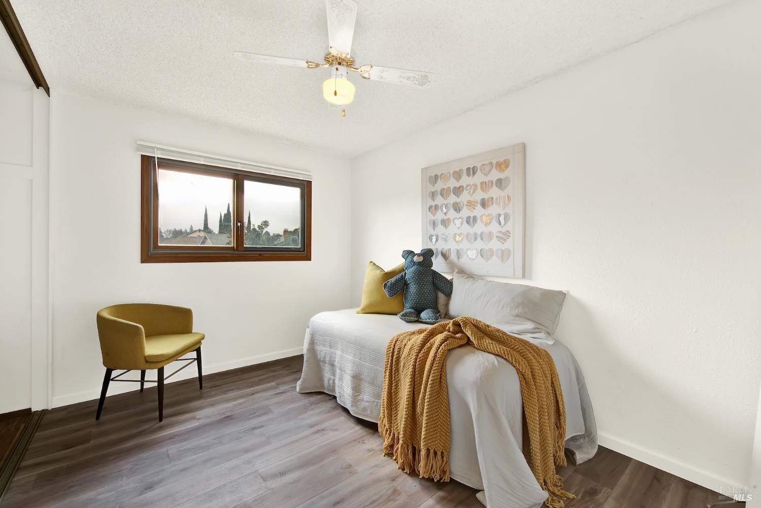 2219 Channing Court Fairfield, CA 94533 - Photo 50 of 81 a bed room with a bed and a chair