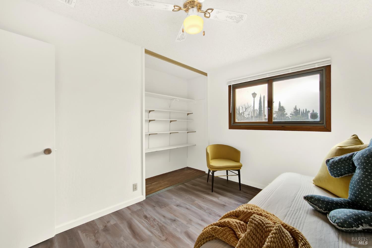 2219 Channing Court Fairfield, CA 94533 - Photo 51 of 81 a bedroom with a bed and a chair