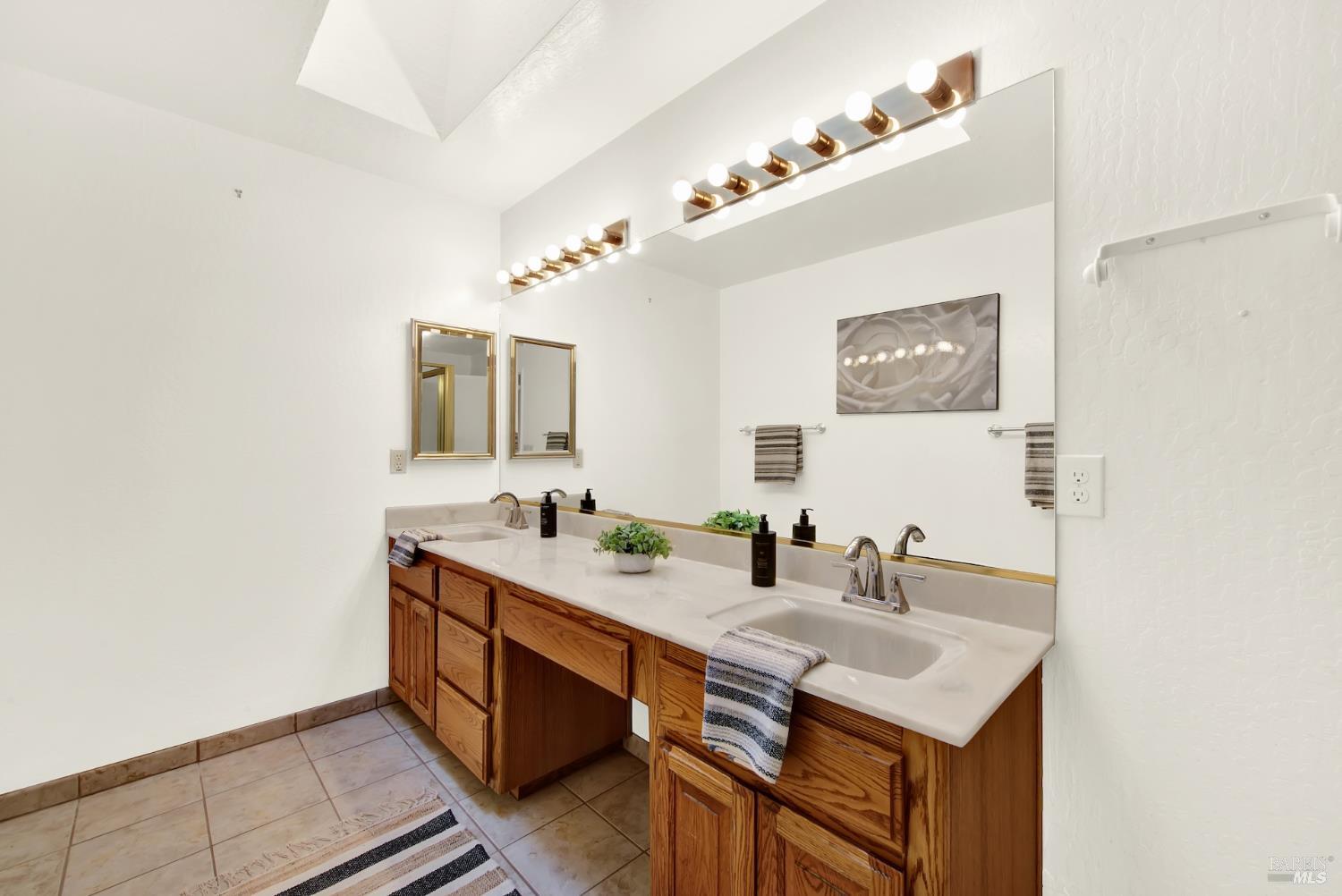 2219 Channing Court Fairfield, CA 94533 - Photo 57 of 81 a bathroom with a sink and a mirror