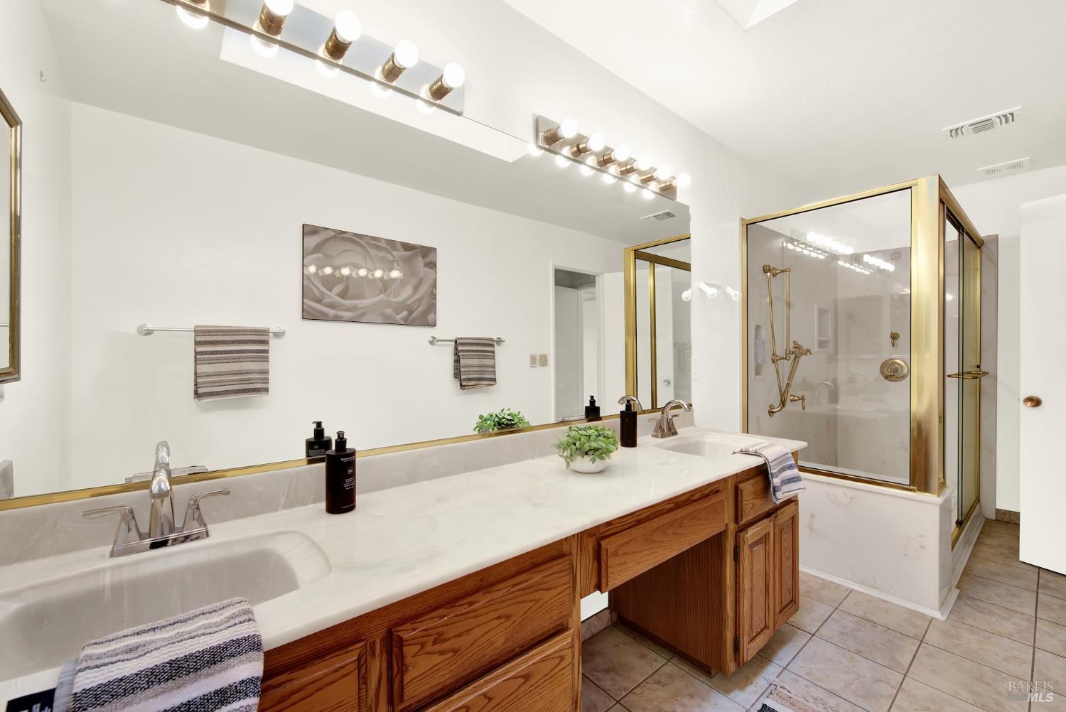 2219 Channing Court Fairfield, CA 94533 - Photo 58 of 81 a bathroom with a double vanity sink mirror and shower