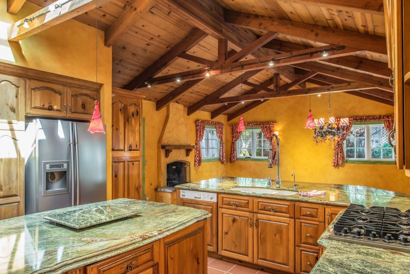 3961 Ronda Road Pebble Beach, CA 93953 - Photo 6 of 15 a kitchen with stainless steel appliances granite countertop a sink and cabinets