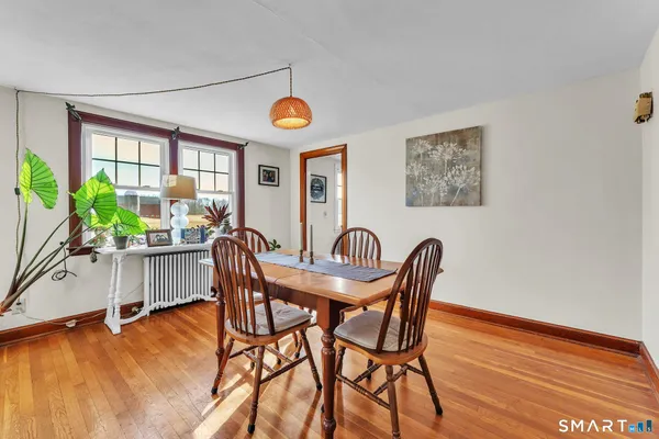 a room with a refrigerator and a table