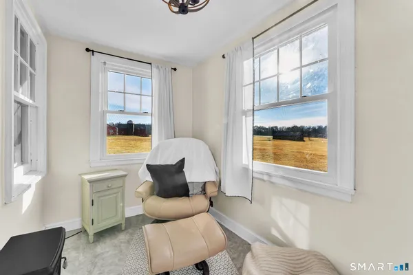 a view of a backyard with sitting area