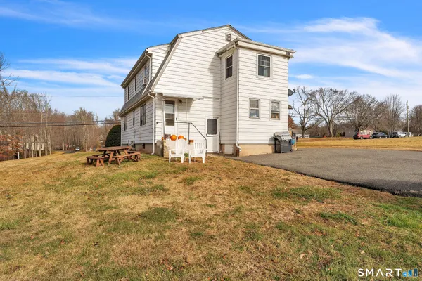 a front view of a house with a yard