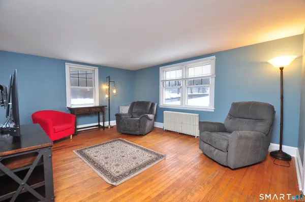 a living room with furniture and a window