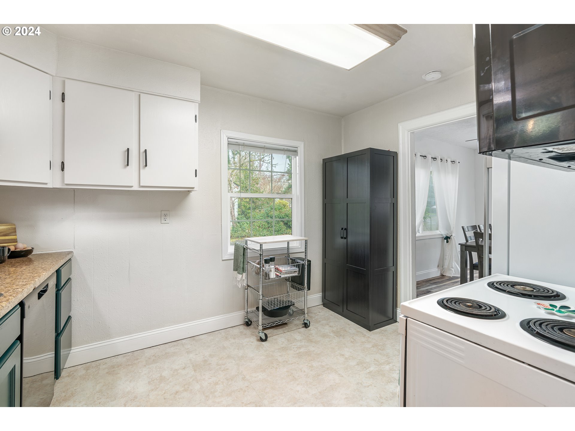 3305 Northwest Glencoe Road Hillsboro, OR 97124 - Photo 11 of 36 a kitchen with a refrigerator and a stove