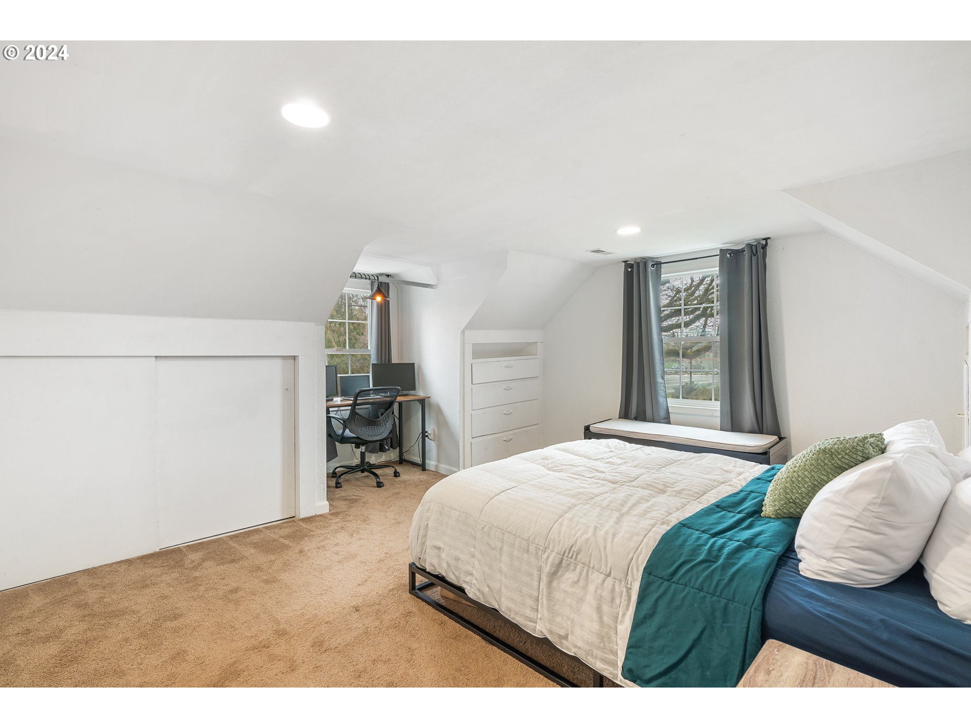 3305 Northwest Glencoe Road Hillsboro, OR 97124 - Photo 15 of 36 a bedroom with a bed and a chair