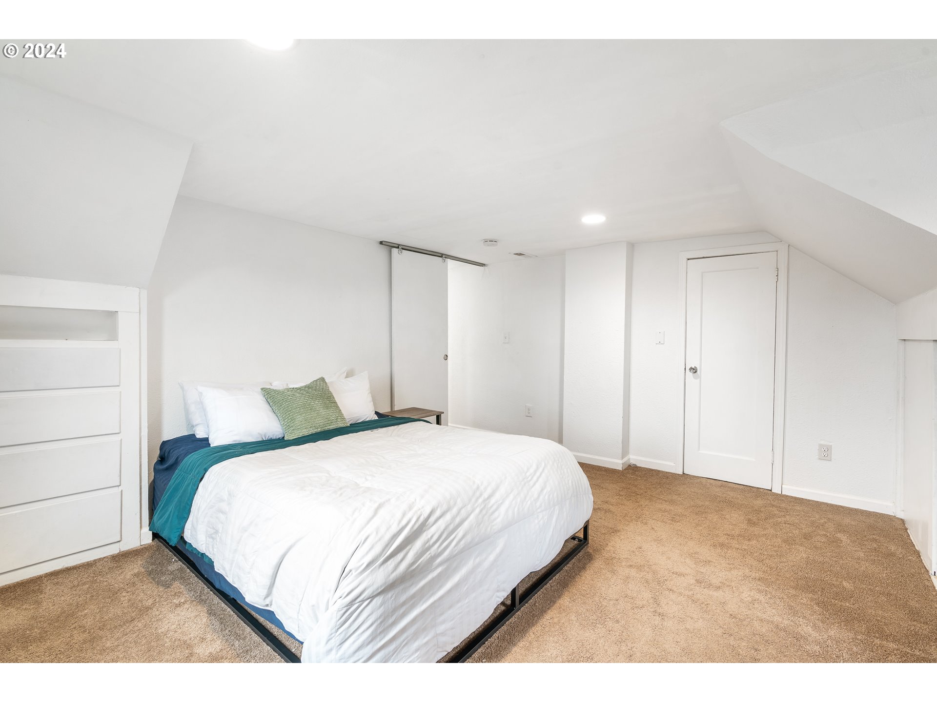 3305 Northwest Glencoe Road Hillsboro, OR 97124 - Photo 17 of 36 a bedroom with a bed and a painting