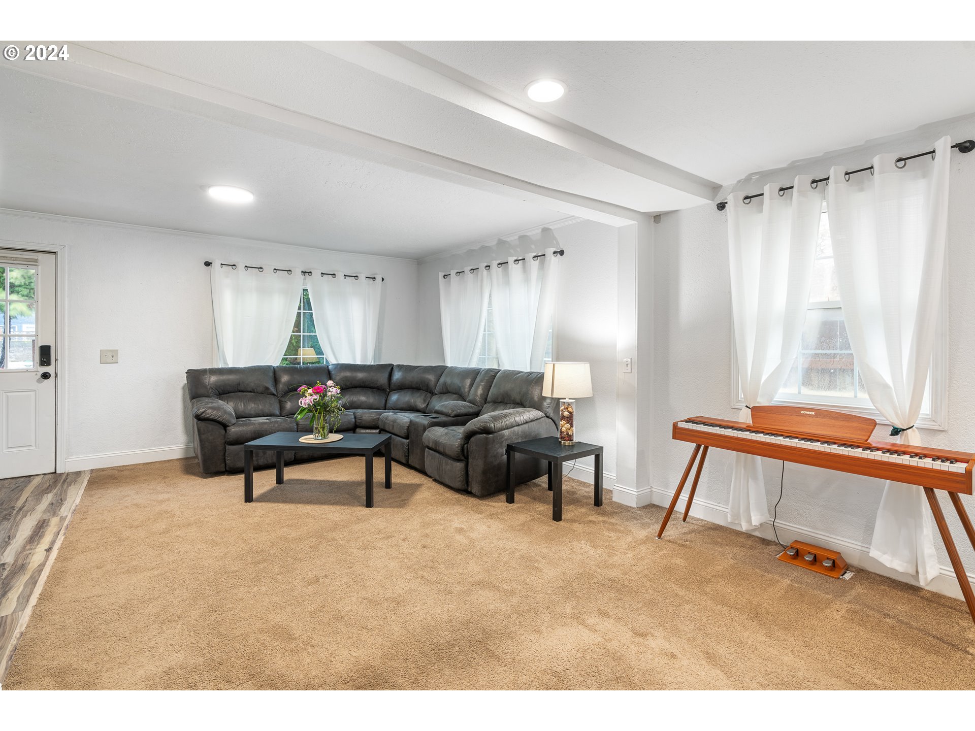 3305 Northwest Glencoe Road Hillsboro, OR 97124 - Photo 3 of 36 a living room with furniture and a wooden floor
