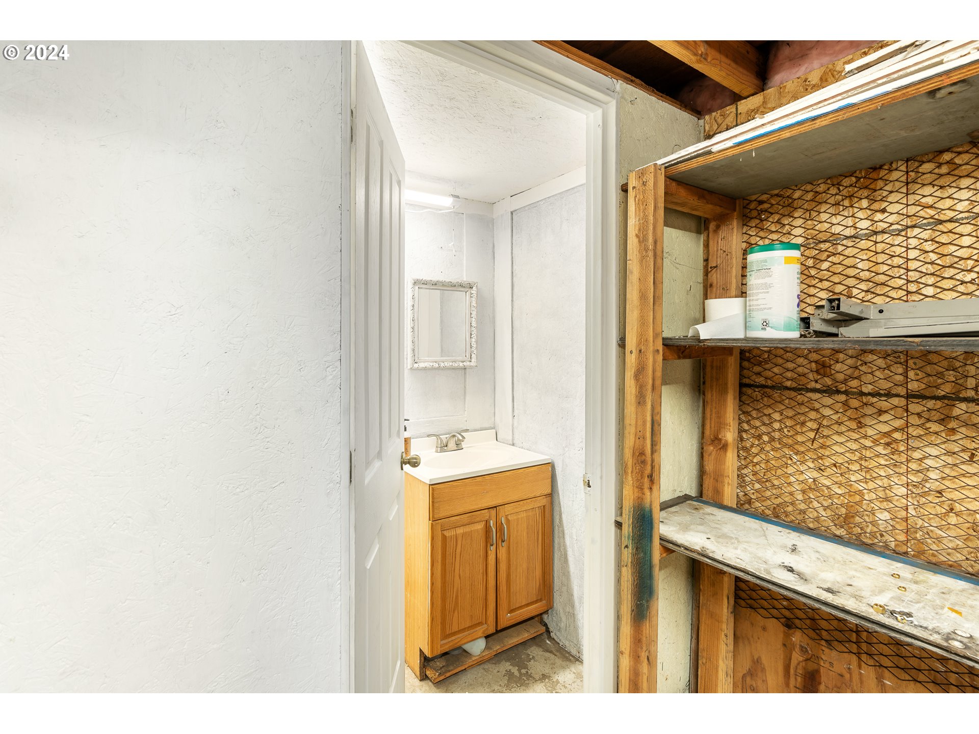 3305 Northwest Glencoe Road Hillsboro, OR 97124 - Photo 33 of 36 a bathroom with a sink a mirror and window
