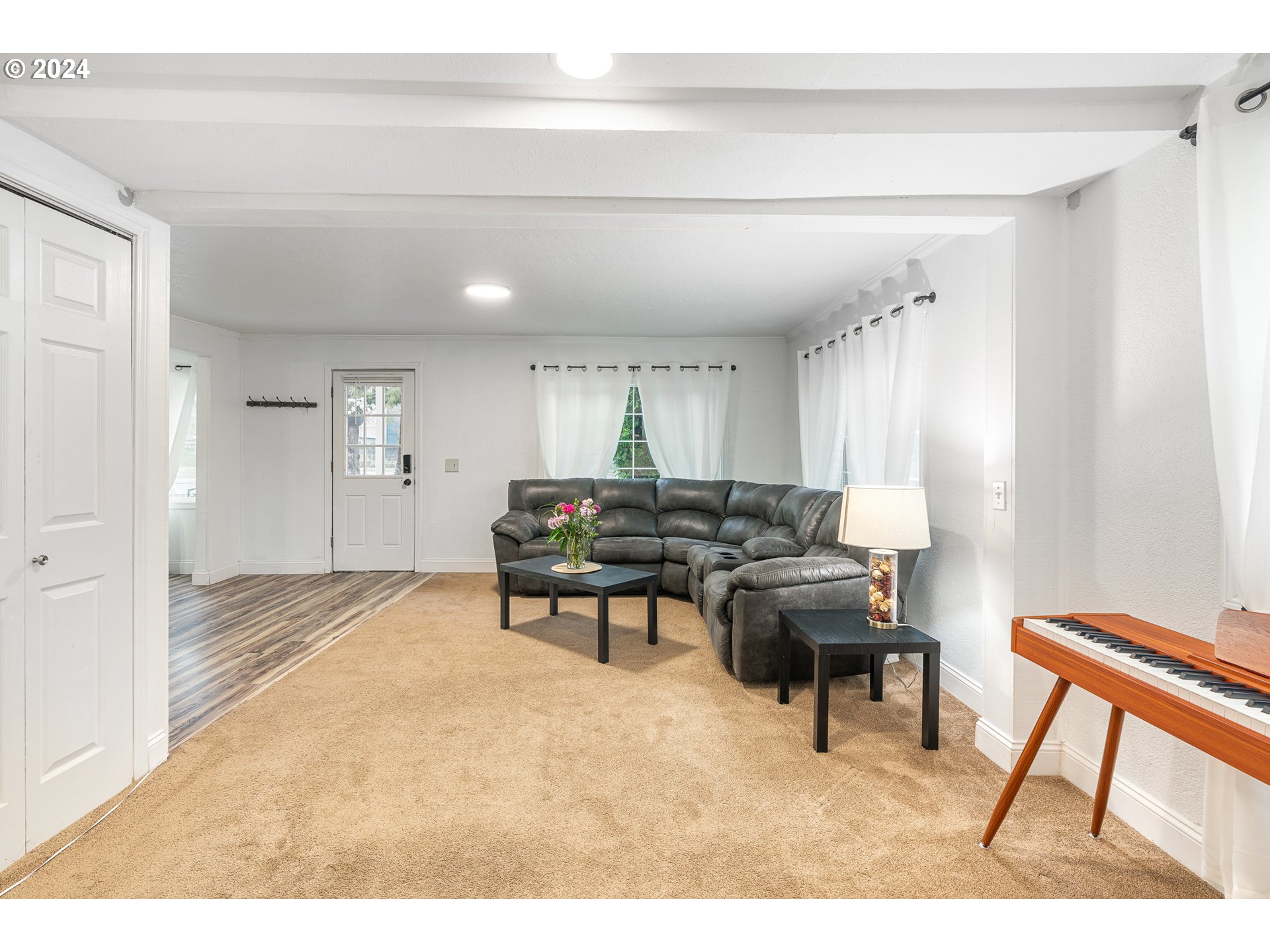 3305 Northwest Glencoe Road Hillsboro, OR 97124 - Photo 4 of 36 a living room with furniture and a piano