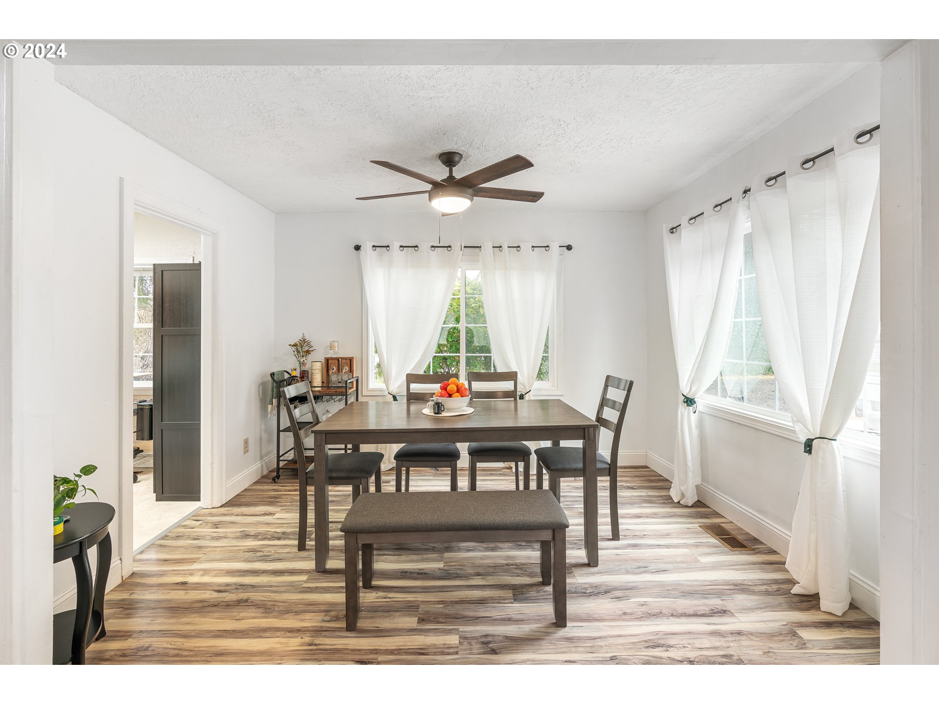 3305 Northwest Glencoe Road Hillsboro, OR 97124 - Photo 5 of 36 a view of a a dining room with furniture window and wooden floor