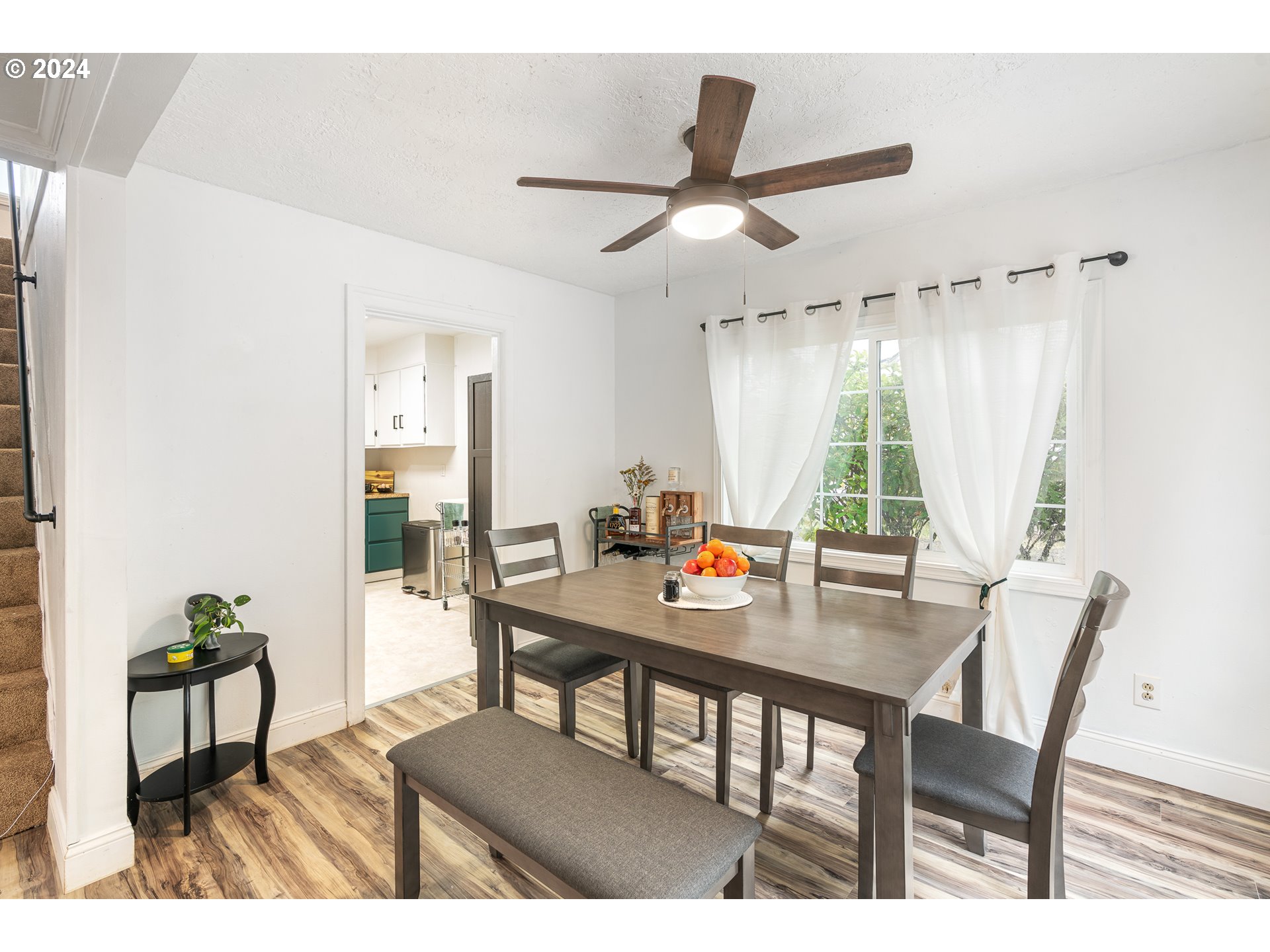 3305 Northwest Glencoe Road Hillsboro, OR 97124 - Photo 6 of 36 a view of a dining room with furniture window and wooden floor