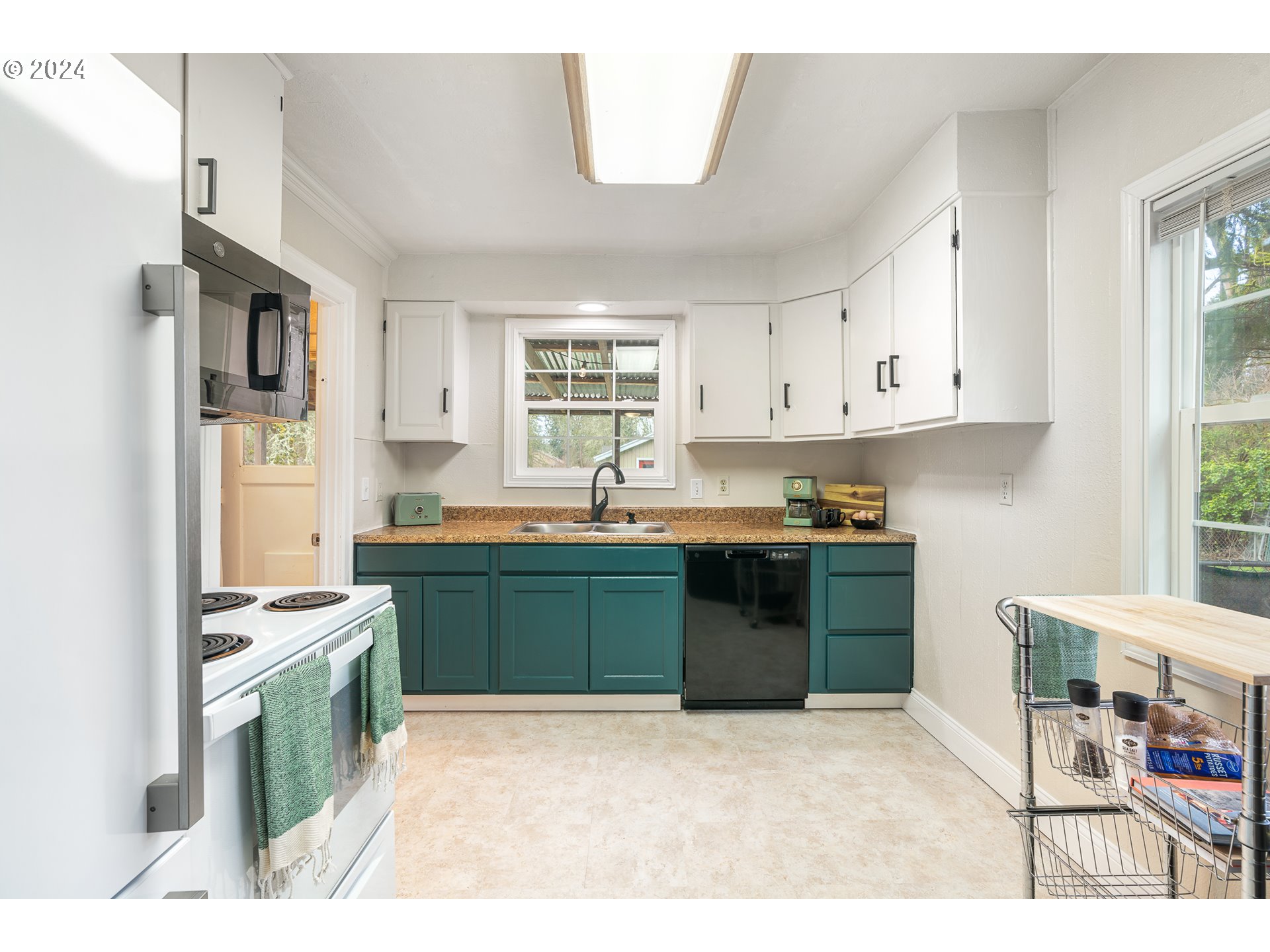 3305 Northwest Glencoe Road Hillsboro, OR 97124 - Photo 8 of 36 a kitchen with stainless steel appliances granite countertop a stove a sink dishwasher and a refrigerator