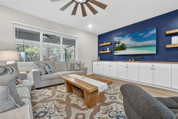 a kitchen with stainless steel appliances kitchen island granite countertop a refrigerator and a sink