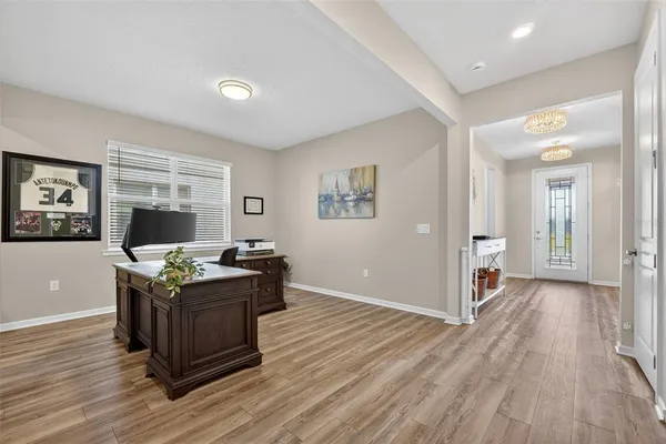 a spacious bathroom with a double vanity sink a large mirror a shower and a bathtub