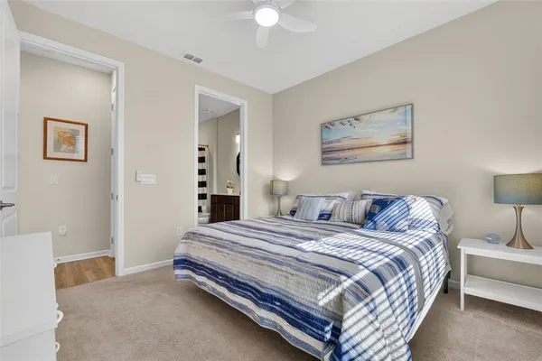 a view of walk in closet with clothes
