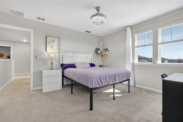 a view of a backyard with a table and chairs