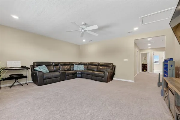 a front view of a house with a yard and green space